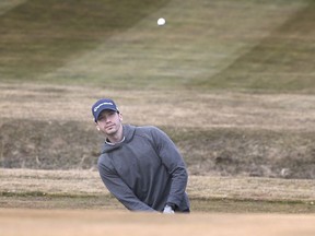 Tee times were sold out on Wednesday, March 10, 2021 at Fox Glen Golf Club in Amherstburg as golfers enjoyed unseasonably warm weather. Matthew Zahorak chips a shot during his round.