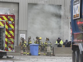 Windsor firefighters are shown at the scene of a fire at the Windsor Disposal Services facility on Deziel Drive on Thursday, March 18, 2021.