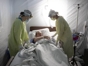 COVID-19 patient Vince Norris, 65, is looked after by medical staff at Windsor Regional Hospital's field hospital at the St. Clair College SportsPlex on May 13, 2020, during the COVID-19 pandemic. Reducing wait times for medical procedures and investing in new hospitals, clinics, and other facilities are top of mind for local residents when it comes to improving health care in Windsor Essex.