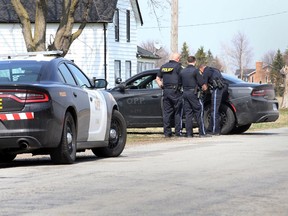 OPP officers take one suspect into custody on Hopgood Side Road in Lakeshore following a serious stabbing incident which occurred about 3 kms. away near Sadler's Pond in Essex, Monday April 5, 2021.  The stabbing victim was transported under OPP escort to Ouellette Campus of Windsor Regional Hospital. Multiple OPP units searched the area for the two suspects.