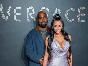 Kanye West and Kim Kardashian West attend the the Versace fall 2019 fashion show at the American Stock Exchange Building in lower Manhattan on Dec. 2, 2018 in New York City.