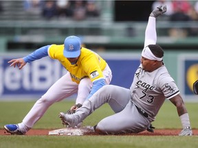 Yermin Mercedes of the Chicago White Sox is tagged out at second base by Christian Arroyo of the Boston Red Sox in the fifth inning of the MLB game at Fenway Park on April 17, 2021 in Boston, Massachusetts.