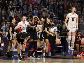 The Stanford Cardinal celebrate after defeating the South Carolina Gamecocks in the Final Four semifinal game of the 2021 NCAA Women's Basketball Tournament at the Alamodome on April 02, 2021 in San Antonio, Texas.