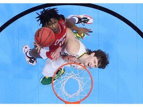 Tramon Mark of the Houston Cougars shoots the ball against Matthew Mayer of the Baylor Bears in the second half during the 2021 NCAA Final Four semifinal at Lucas Oil Stadium on April 03, 2021 in Indianapolis, Indiana.