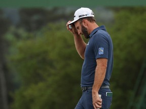 Dustin Johnson of the United States reacts on the 18th green during the second round of the Masters at Augusta National Golf Club on April 09, 2021 in Augusta, Georgia.