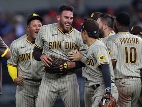 Joe Musgrove of the San Diego Padres celebrates with his team after pitching a no-hitter against the Texas Rangers at Globe Life Field on April 09, 2021 in Arlington, Texas.  This was the Padres first no-hitter in franchise history.