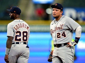 Miguel Cabrera and Niko Goodrum of the Detroit Tigers react to a call in the sixth inning against the Cleveland Indians during a game at Progressive Field on April 10, 2021 in Cleveland, Ohio.