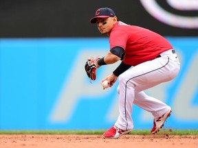 Andres Gimenez of the Cleveland Indians makes a throw to first base for an out in the sixth inning during a game against the Detroit Tigers at Progressive Field on April 11, 2021 in Cleveland, Ohio.