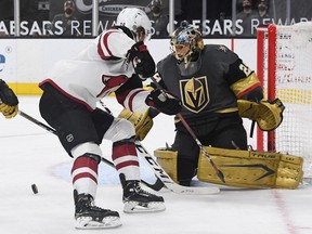 Marc-Andre Fleury of the Vegas Golden Knights makes a save against Dryden Hunt of the Arizona Coyotes in the first period of their game at T-Mobile Arena on April 11, 2021 in Las Vegas, Nevada. The Golden Knights defeated the Coyotes 1-0.