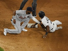 Tim Anderson of the Chicago White Sox is tagged out trying to steal second base by Niko Goodrum of the Detroit Tigers at Guaranteed Rate Field on April 27, 2021 in Chicago, Illinois.