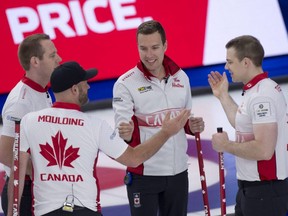 Team Canada skip Brendan Botcher (second from right) celebrates with his team after defeating Team USA 10-1 at the World Men's Curling Championship in Calgary on Monday, April 5, 2021.