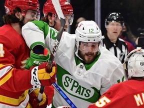 Maple Leafs' Alex Galchenyuk battles the Calgary Flames during a game in Toronto on Friday, March 19, 2021.