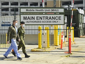 Military health-care personnel prepare for patients at a mobile health unit at Sunnybrook Hospital during the COVID-19 pandemic in Toronto on Tuesday, April 27, 2021.