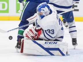 Maple Leafs goalie David Rittich makes a save against the Canucks during the second period of an NHL game in Vancouver, Tuesday, April 20, 2021.