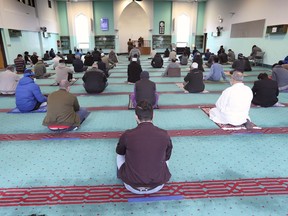 While socially distanced, members of the local Muslim community participate in Ramadan prayers on Friday, April 16, 2021, at the Windsor Mosque.