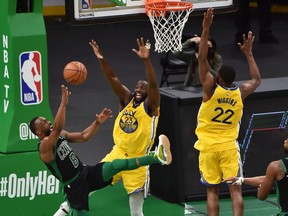Boston Celtics guard Kemba Walker gets fouled by Golden State Warriors forward Draymond Green during the first half at TD Garden.