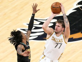 Dallas Mavericks  guard Luka Doncic shoots in the second half as Memphis Grizzlies guard Ja Morant defends at FedExForum. Dallas won 114-113.