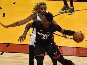 Brooklyn Nets forward Nicolas Claxton defends Miami Heat center Bam Adebayo during the second half at American Airlines Arena.
