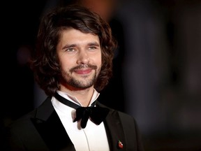 Ben Whishaw, who plays spy gadget master Q in the most recent crop of James Bond movies, poses for photographers on the red carpet at the world premiere of the new 007 film "Spectre" at the Royal Albert Hall in London, Britain, October 26, 2015.