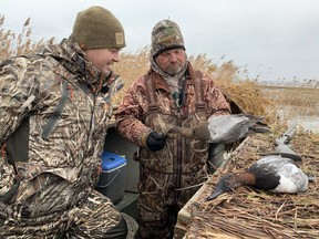 Canada in the Rough host and co-producer Keith Beasley, left, receives advice from guide Robert Stanley during a visit to Mitchell's Bay in December 2020. Photo courtesy of OutdoorSpot Media Group