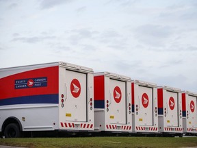 Canada Post vehicles in Toronto are shown in this October 2018 file photo.