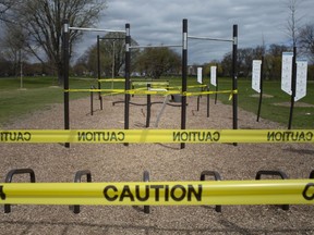 Yellow caution tape surrounds outdoor exercise equipment at Lakewood Park in Tecumseh after more COVID-19 restrictions were put in place by Premier Doug Ford on Saturday, April 17, 2021.