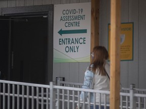 A woman walks into the COVID_19 assessment centre at Windsor Regional Hospital - Met Campus, on Thursday, April 15, 2021.