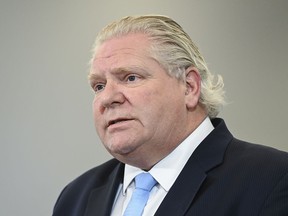 Ontario Premier Doug Ford answers questions from the media at the Seneca College mass vaccination site during the COVID-19 pandemic in Toronto on Tuesday, April 6, 2021.