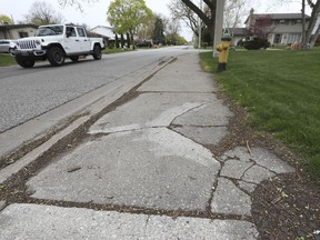 A cracked and uneven section of sidewalk is shown on Labelle Street in Windsor on Tuesday. Uneven sidewalks are one of the main reasons for trip-and-fall claims made against the city.