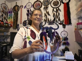 Marlene Paul is shown in her Windsor apartment on Wednesday, April 28, 2021 with some of the Dream Catchers she made using 3D printers.