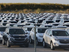 FILE PHOTO: Chevrolet Equinox SUVs are parked awaiting shipment next to the General Motors Co (GM) CAMI assembly plant in Ingersoll, Ontario, Canada October 13, 2017.