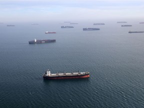 Container ships and oil tankers wait in the ocean outside the Port of Long Beach-Port of Los Angeles complex, amid the coronavirus disease (COVID-19) pandemic, in Los Angeles, California, April 7, 2021.