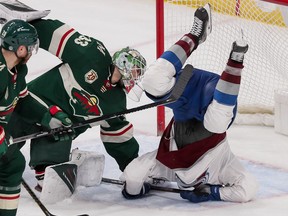 Minnesota Wild defenseman Ian Cole trips Colorado Avalanche forward Mikko Rantanen in the third period at Xcel Energy Center.