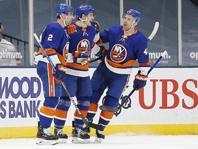 New York Islanders center Mathew Barzal is congratulated after scoring a goal against the Washington Capitals during the first period at Nassau Veterans Memorial Coliseum.