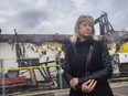 Paula Ouellette, former owner of Paula's Fish Place on Point Pelee Drive, stands in front of the charred remains on Monday, April 5, 2021.  Ouellette owned and managed the restaurant for 28 years.