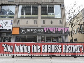 The local chamber of commerce is warning things could get tougher for small business. Shown here on Friday, April 16, 2021, a downtown Windsor business's message to the government: "Stop holding this Business Hostage!"