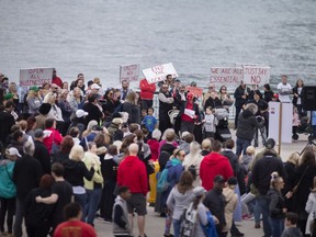 Approximately a hundred people gathered at the foot of Ouellette Avenue again for their weekly COVID-19 lockdown protest on Saturday, April 24, 2021.