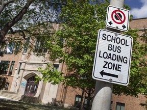 The front of Queen Victoria Public School in Windsor, with signs warning motorists not to stop, is pictured on Friday, April 30, 2021.