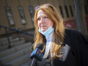 Assistant Crown attorney Elizabeth Brown speaks with the media following the sentencing of a Windsor man to 6.5 years for killing his infant son and assaulting the other, while outside Supreme Court on Tuesday, April 13, 2021.