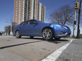 A motorist travels over a speed bump on Riverside Drive East near the Windsor Yacht Club on Tuesday, April 13, 2021. Mayor Drew Dilkens is suggesting traffic calming measures instead of reduced speed limits.