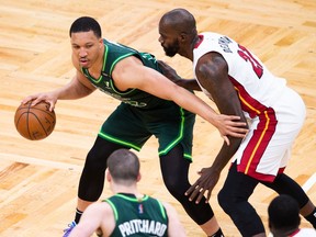 Grant Williams of the Boston Celtics is defended by Dewayne Dedmon of the Miami Heat in the second half at TD Garden on May 11, 2021 in Boston, Massachusetts.