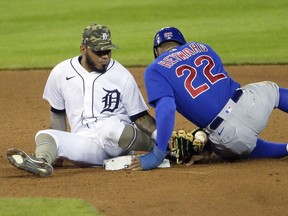 Second baseman Harold Castro of the Detroit Tigers holds onto the ball after tagging Jason Heyward of the Chicago Cubs after he attempted steal second base at Comerica Park on May 14, 2021, in Detroit, Michigan. Jason Heyward was ruled out due to batters interference by Willson Contreras.