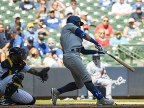 Matt Beaty #45 of the Los Angeles Dodgers hits a grand slam in the second inning against the Milwaukee Brewers at American Family Field on May 2, 2021, in Milwaukee, Wisconsin.