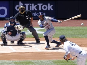 Jose Altuve #27 of the Houston Astros singles during the first inning against Gerrit Cole #45 of the New York Yankees at Yankee Stadium on May 6, 2021, in New York City.