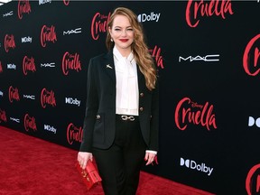 Emma Stone arrives at the premiere for Cruella at the El Capitan Theatre on May 18, 2021, in Los Angeles, California.