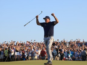 Phil Mickelson of the United States celebrates on the 18th green after winning during the final round of the 2021 PGA Championship held at the Ocean Course of Kiawah Island Golf Resort on May 23, 2021 in Kiawah Island, South Carolina.