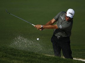 Phil Mickelson hits from the bunker on the 11th hole during the first round of the Charles Schwab Challenge at Colonial Country Club on May 27, 2021 in Fort Worth, Texas.