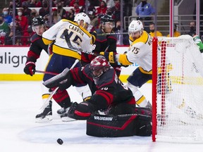 Hurricanes goaltender Alex Nedeljkovic makes a second period save against the Predators in Game 2 of the first round of the 2021 Stanley Cup Playoffs at PNC Arena in Raleigh, N.C., Wednesday, May 19, 2021.