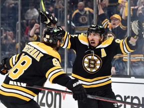 Bruins centre Brad Marchand (right) reacts on a goal by right wing David Pastrnak (left) during the second period in Game 4 of the first round of the 2021 Stanley Cup Playoffs against the Capitals at TD Garden in Boston, Friday, May 21, 2021.