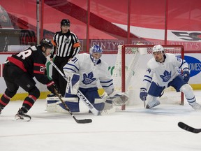 Senators' Connor Brown shoots past Maple Leafs goalie Frederik Andersen and centre Auston Matthews to score a goal in the second period at the Canadian Tire Centre on Wednesday, May 12, 2021.